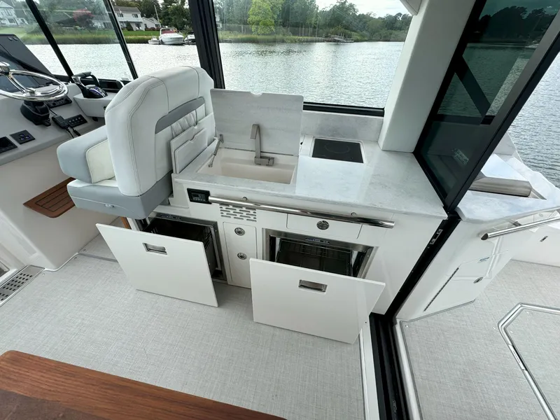 Slide: The Image of Modern kitchen area on 2026 Regal 36 XO yacht with sink and appliances. - 22