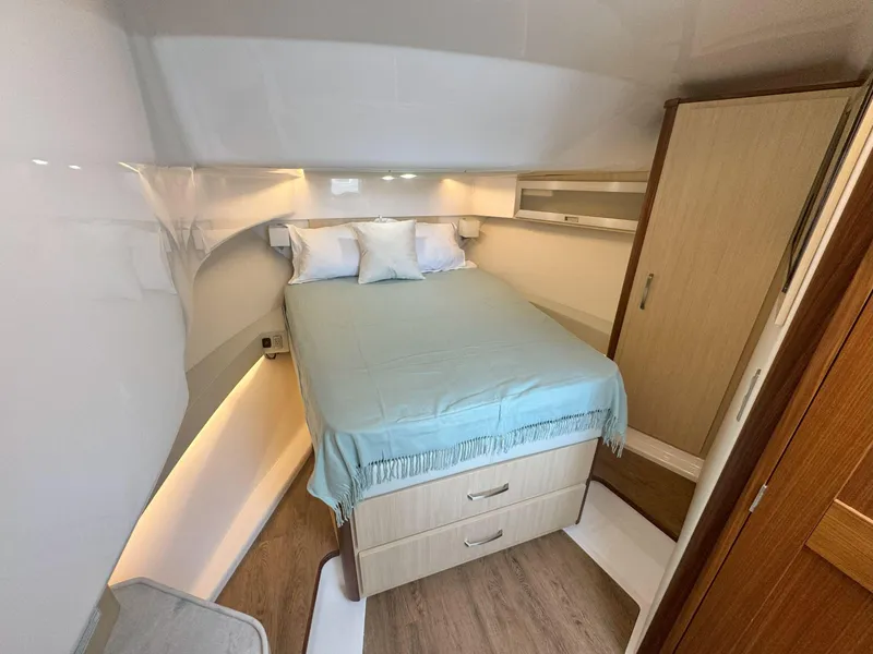 Slide: The Image of Luxurious cabin interior of 2026 Regal 36 XO yacht with cozy bed and modern design. - 32