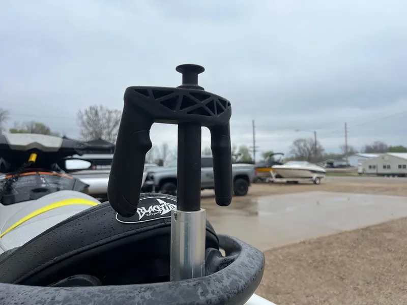 Slide: The Image of 2014 Sea-Doo Wake Pro 215 handle detail in a parking lot. - 10