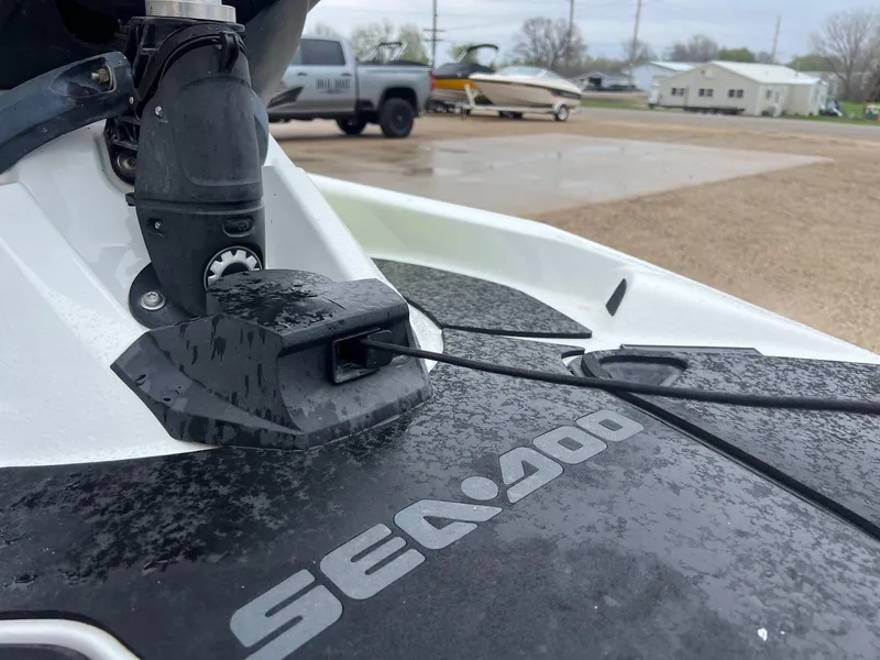 Slide: The Image of 2014 Sea-Doo Wake Pro 215 jet ski detail with wet surface and logo. - 11
