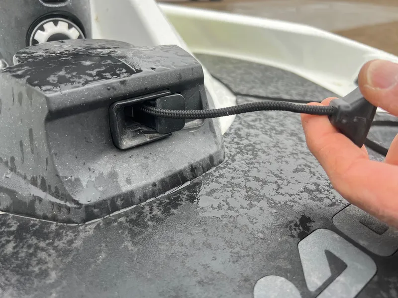 Slide: The Image of Close-up of a 2014 Sea-Doo Wake Pro 215 ignition key being inserted. - 12