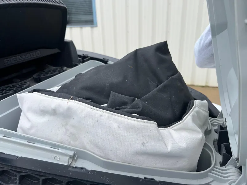 Slide: The Image of 2014 Sea-Doo Wake Pro 215 storage compartment with black and white cover inside. - 13