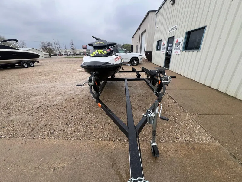 Slide: The Image of 2014 Sea-Doo Wake Pro 215 on trailer outside a building, overcast sky. - 16