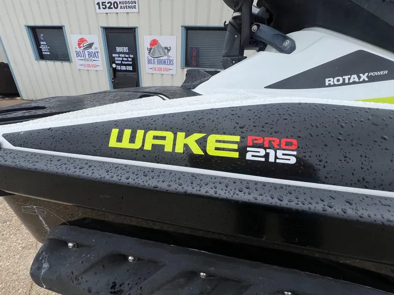 Slide: The Image of 2014 Sea-Doo Wake Pro 215 jet ski with Rotax power, wet from rain. - 3