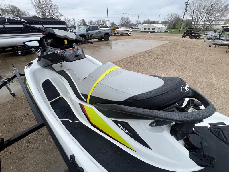 Slide: The Image of 2014 Sea-Doo Wake Pro 215 jet ski with Rotax engine, parked outdoors. - 5