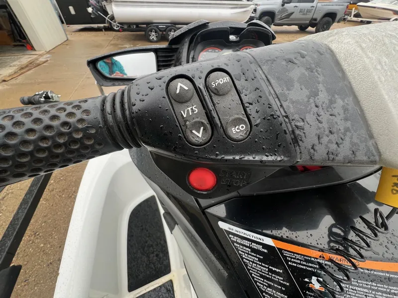 Slide: The Image of Close-up of 2014 Sea-Doo Wake Pro 215 handlebar controls with water droplets. - 9