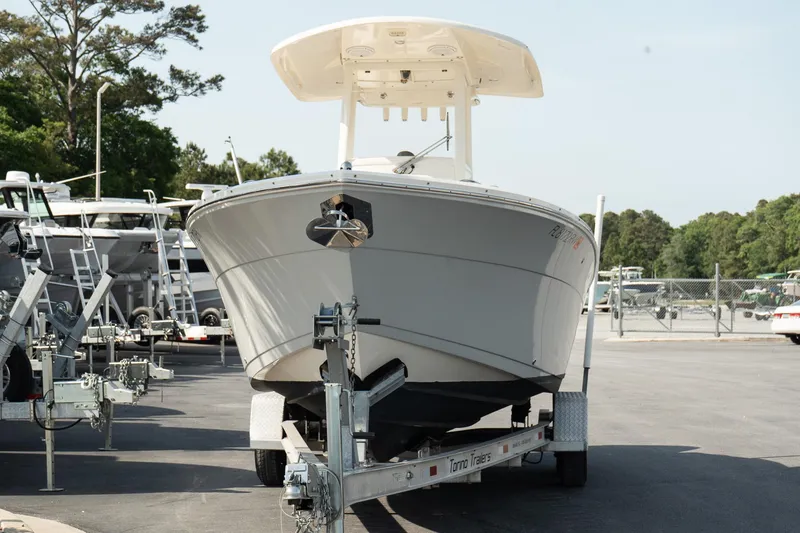 Slide: The Image of 2019 Cobia 240 Center Console boat on trailer in parking lot. - 3