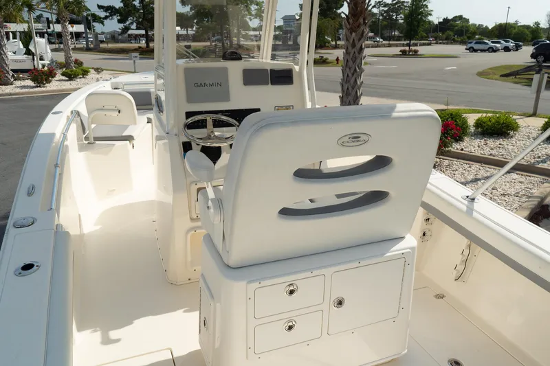 Slide: The Image of 2019 Cobia 240 Center Console boat interior with helm and seating. - 7