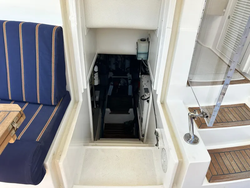 Slide: The Image of 2004 Grand Banks 49 Eastbay HX interior with stairs and seating area. - 128