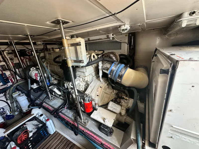 Slide: The Image of Engine room of 2004 Grand Banks 49 Eastbay HX, showcasing mechanical components and systems. - 130