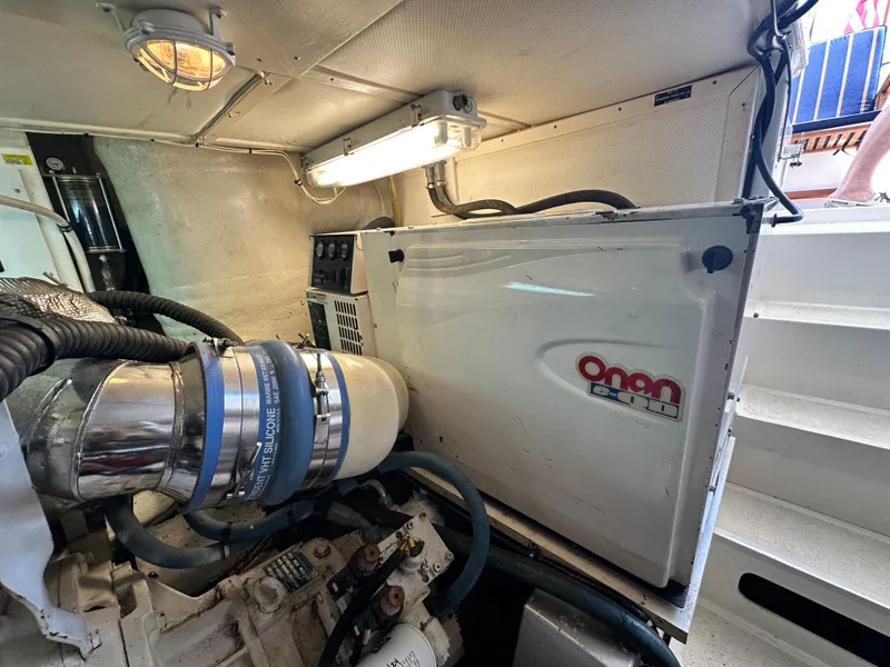 Slide: The Image of Engine room of 2004 Grand Banks 49 Eastbay HX with Onan generator. - 131