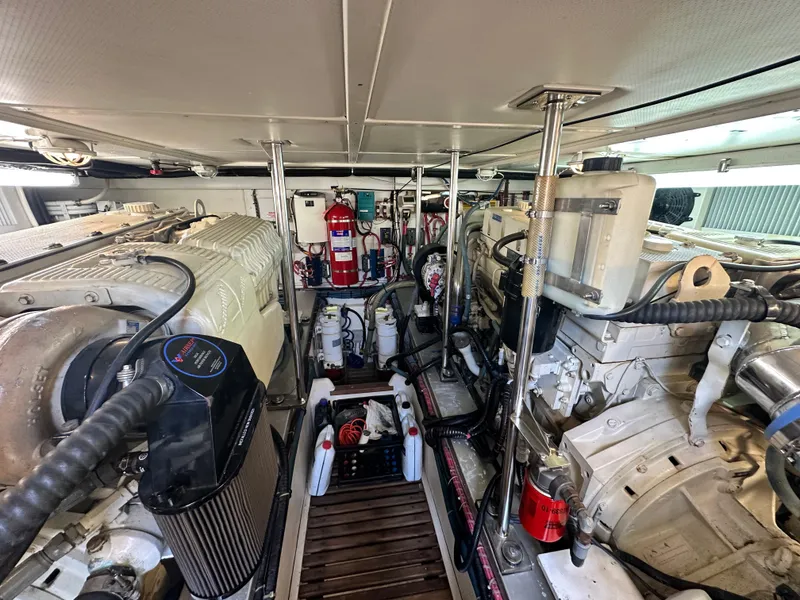 Slide: The Image of Engine room of 2004 Grand Banks 49 Eastbay HX, showcasing dual engines and equipment. - 134