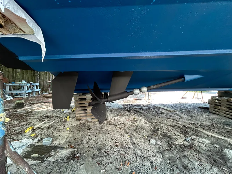 Slide: The Image of 2004 Grand Banks 49 Eastbay HX boat propeller and hull on dry dock. - 23