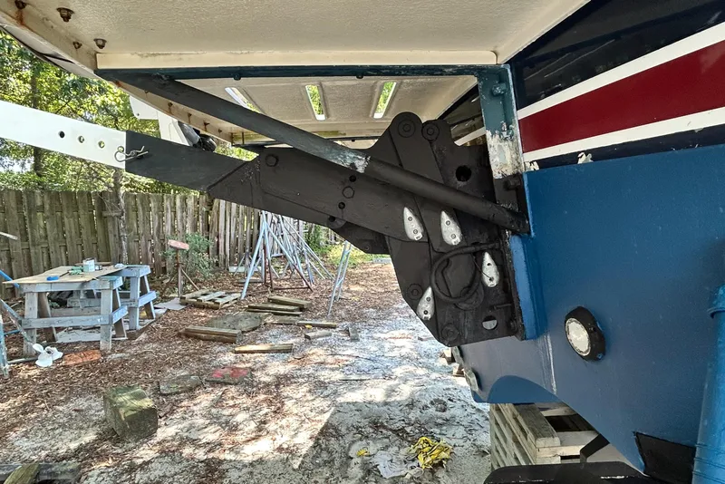 Slide: The Image of 2004 Grand Banks 49 Eastbay HX boat under maintenance, showing hull and rudder details. - 24