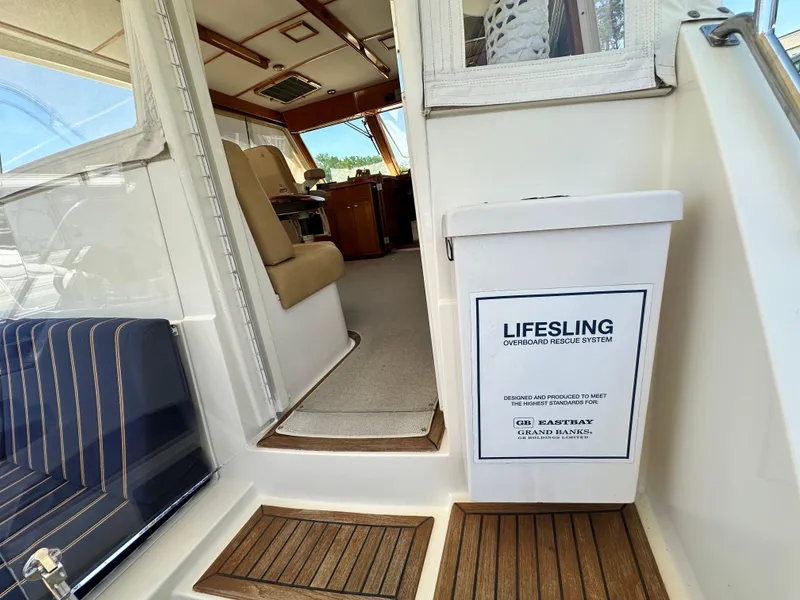 Slide: The Image of 2004 Grand Banks 49 Eastbay HX interior with Lifesling overboard rescue system. - 38