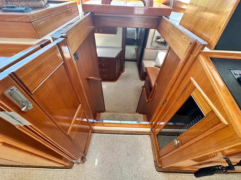 Slide: The Image of Interior view of 2004 Grand Banks 49 Eastbay HX yacht with wooden cabinetry and carpeted flooring. - 41