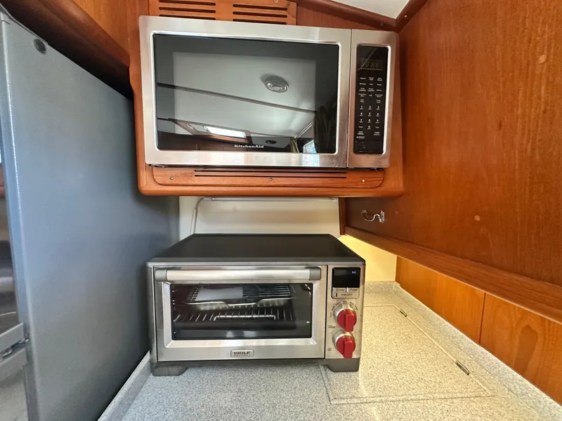 Slide: The Image of Microwave and toaster oven in 2004 Grand Banks 49 Eastbay HX yacht kitchen. - 54
