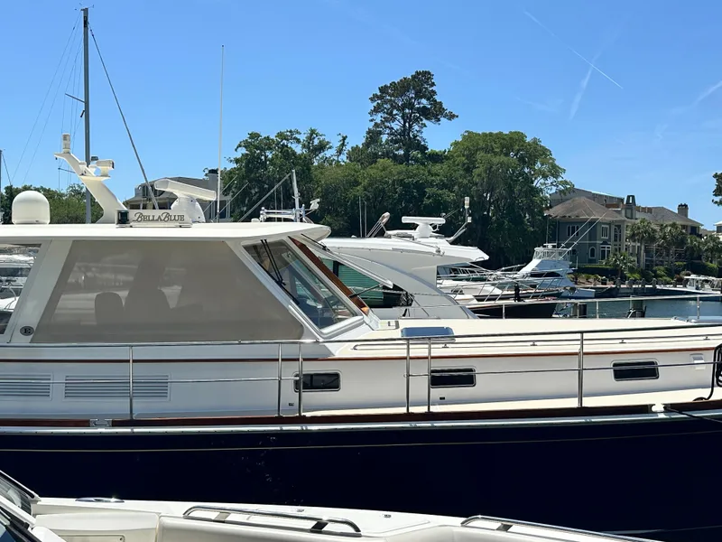 Slide: The Image of 2004 Grand Banks 49 Eastbay HX yacht docked at a marina on a sunny day. - 6