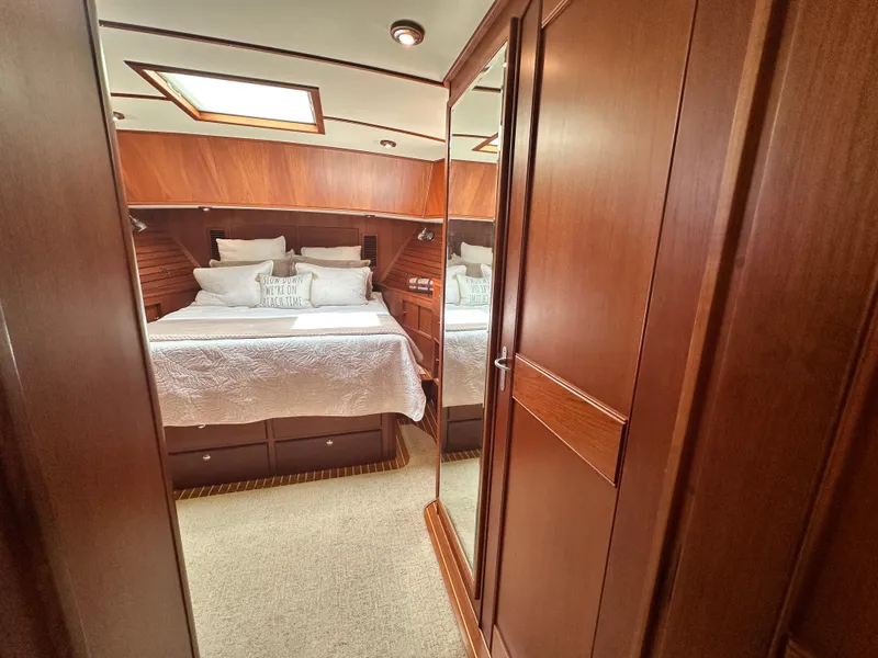 Slide: The Image of Luxurious cabin interior of 2004 Grand Banks 49 Eastbay HX yacht with wood finish. - 60
