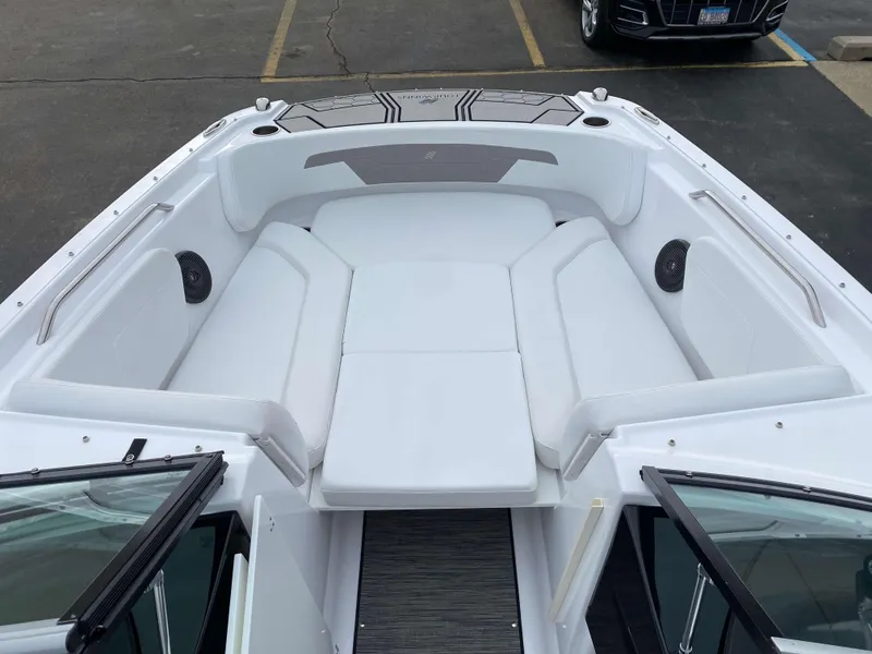 Slide: The Image of 2022 Four Winns HD2 Surf boat with spacious white seating area. - 13