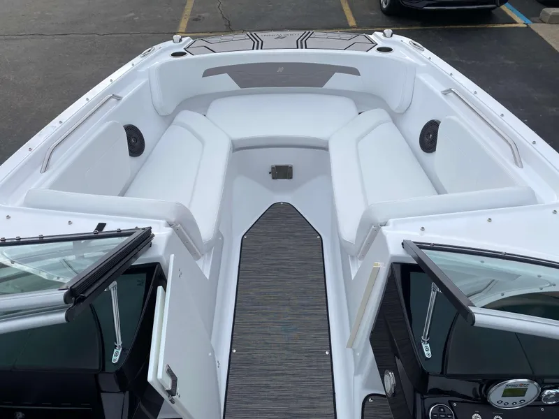 Slide: The Image of 2022 Four Winns HD2 Surf boat interior with white seating and open windshield. - 14
