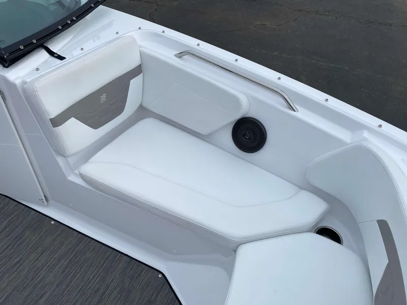 Slide: The Image of 2022 Four Winns HD2 Surf boat interior with white seating and speaker. - 15