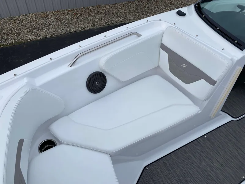 Slide: The Image of 2022 Four Winns HD2 Surf boat interior with white seating and speaker. - 16