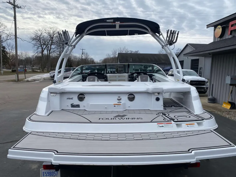 Slide: The Image of 2022 Four Winns HD2 Surf boat with sleek design and spacious deck. - 21
