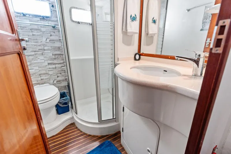 Slide: The Image of Modern yacht bathroom with shower, sink, and toilet in a 2000 Selene Solo. - 28