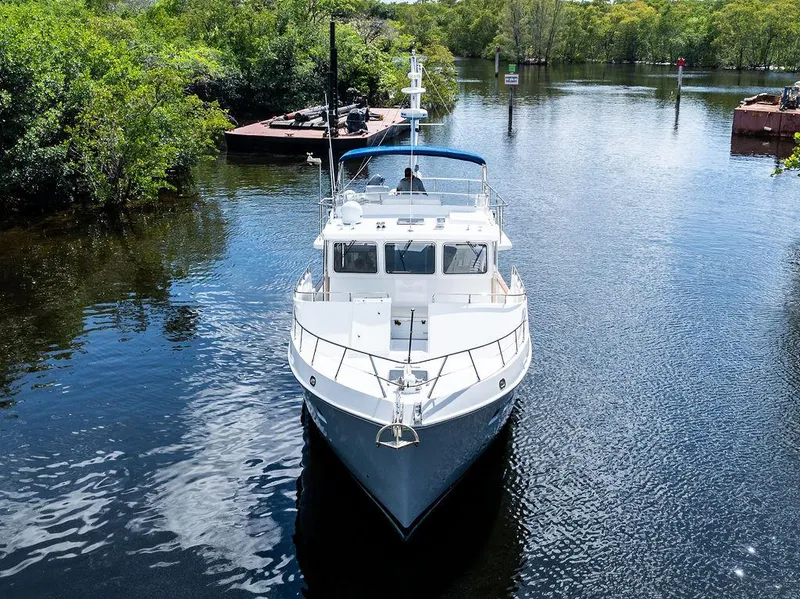 Slide: The Image of Selene Solo 2000 yacht on a serene river surrounded by lush greenery. - 3