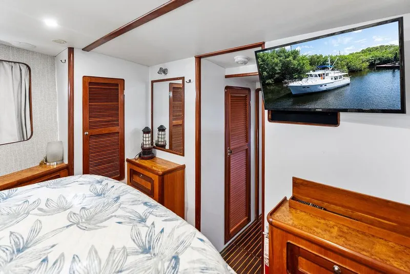 Slide: The Image of Cozy cabin interior of 2000 Selene Solo yacht with TV and wooden furnishings. - 32