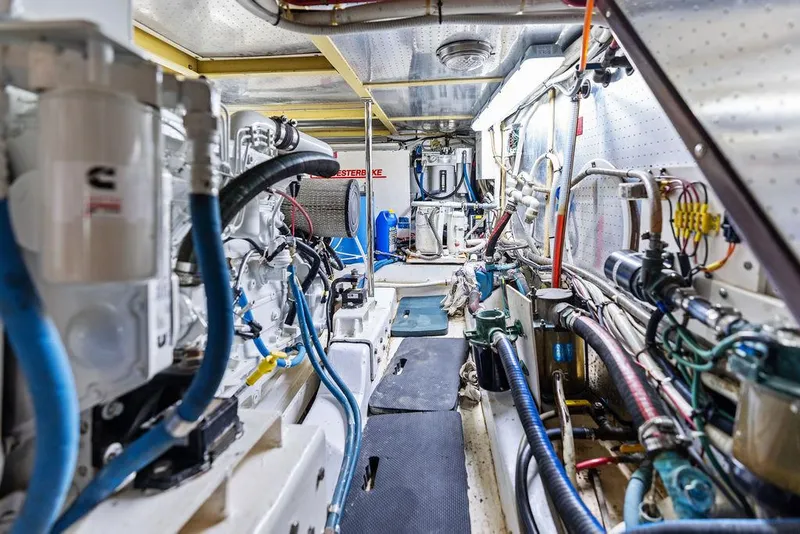 Slide: The Image of Engine room of a 2000 Selene Solo yacht, featuring complex machinery and piping systems. - 35