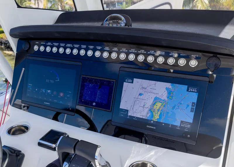 Slide: The Image of 2024 World Cat 260CC dashboard with navigation screens and control panel. - 12