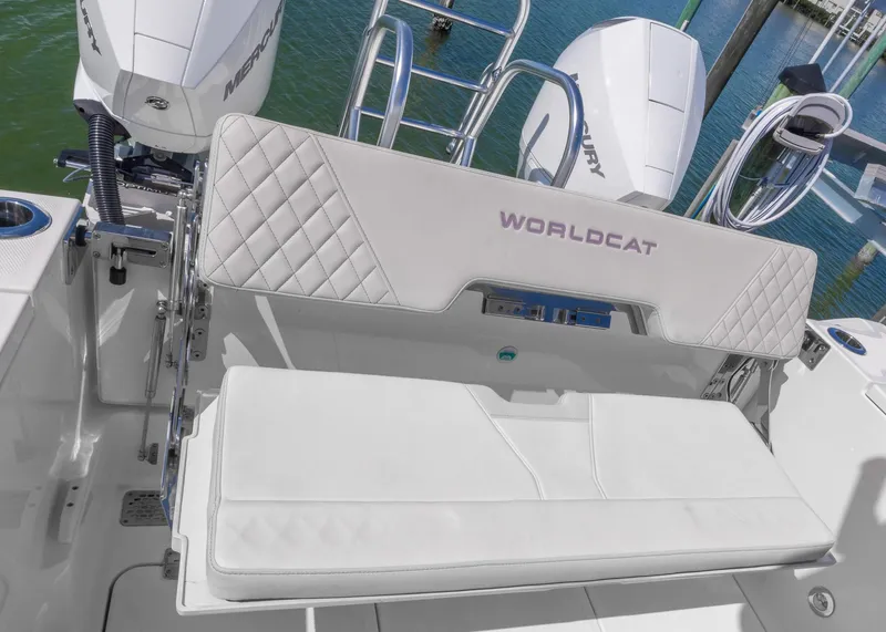 Slide: The Image of 2024 World Cat 260CC boat with cushioned seating and dual Mercury engines. - 17