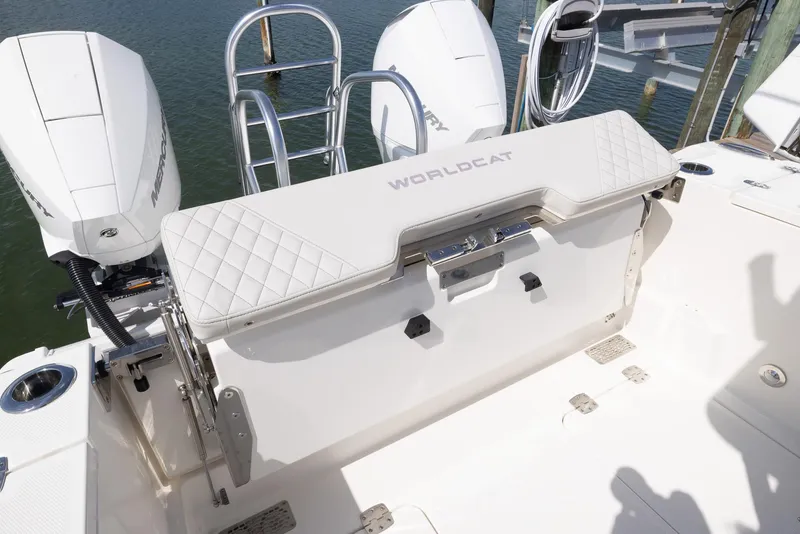 Slide: The Image of 2024 World Cat 260CC boat with dual engines and cushioned seating. - 18