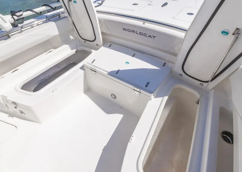 Slide: The Image of 2024 World Cat 260CC boat interior with open storage compartments and sleek design. - 24