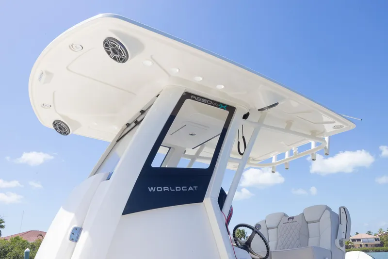 Slide: The Image of 2024 World Cat 260CC boat with sleek design and modern features under a clear blue sky. - 9