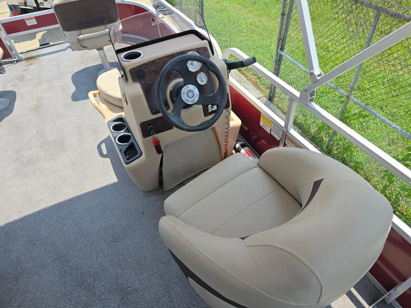 Slide: The Image of 2019 Sun Tracker Bass Buggy 18 DLX boat interior with steering console and seating. - 10