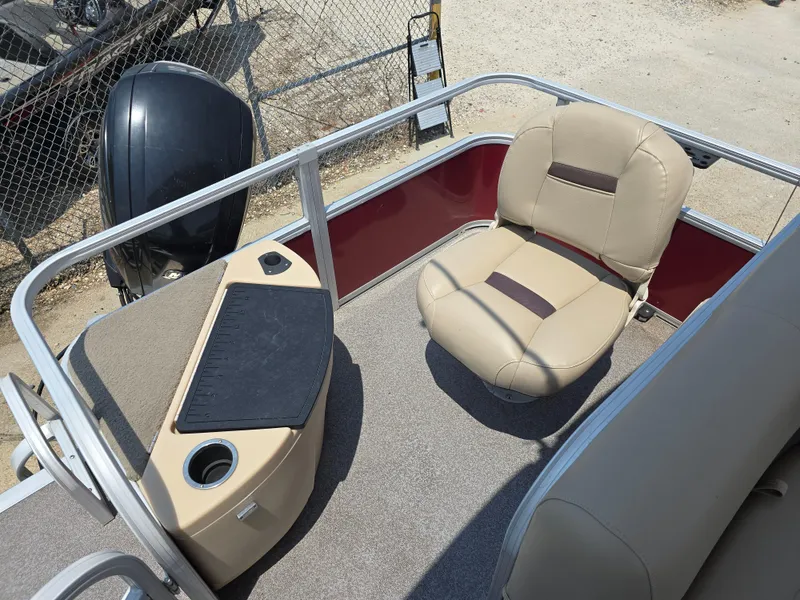 Slide: The Image of 2019 Sun Tracker Bass Buggy 18 DLX interior with beige seating and fishing station. - 11