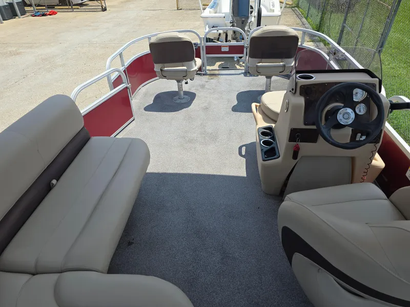 Slide: The Image of 2019 Sun Tracker Bass Buggy 18 DLX pontoon boat interior with seating and steering console. - 12