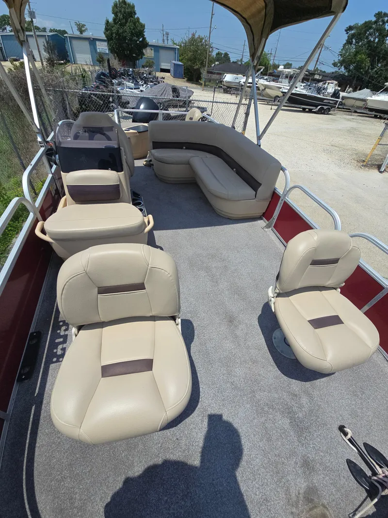 Slide: The Image of 2019 Sun Tracker Bass Buggy 18 DLX pontoon boat with beige seating and canopy. - 6