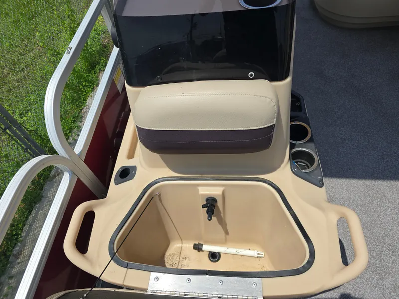 Slide: The Image of 2019 Sun Tracker Bass Buggy 18 DLX boat interior with seating and storage compartment. - 8