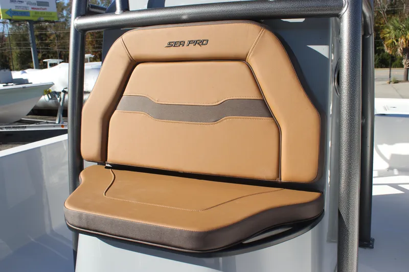 Slide: The Image of 2025 Sea Pro 250 Bay boat seat with tan and gray upholstery. - 11