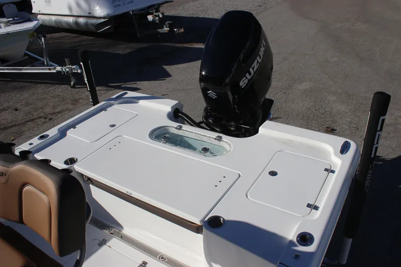 Slide: The Image of 2025 Sea Pro 250 Bay boat with Suzuki outboard motor, featuring a spacious deck layout. - 3