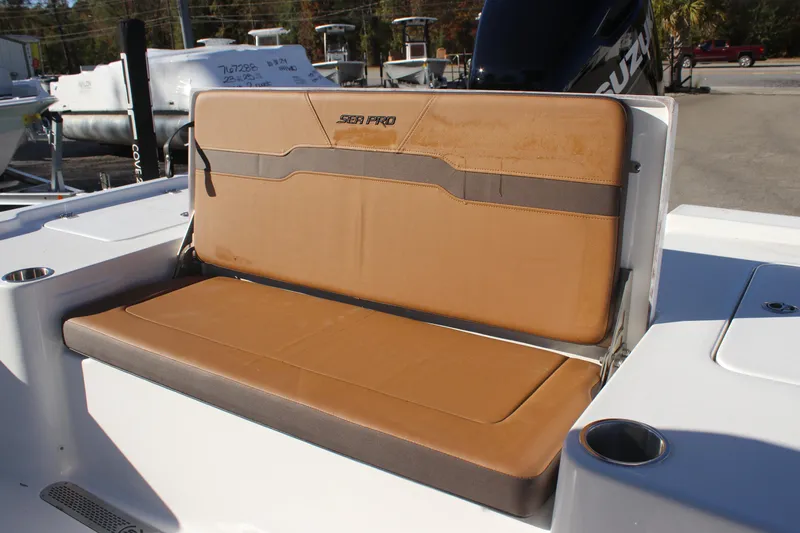 Slide: The Image of 2025 Sea Pro 250 Bay boat with tan cushioned seating and cup holder. - 4