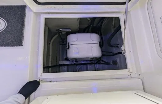 Slide: The Image of 2020 Aquila 36 Sport engine compartment with visible equipment and wiring. - 10