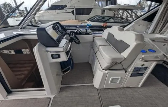 Slide: The Image of Interior of 2020 Aquila 36 Sport boat with modern helm and seating. - 2