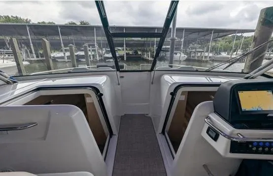 Slide: The Image of Aquila 36 Sport 2020 boat interior with open compartments and navigation system. - 5