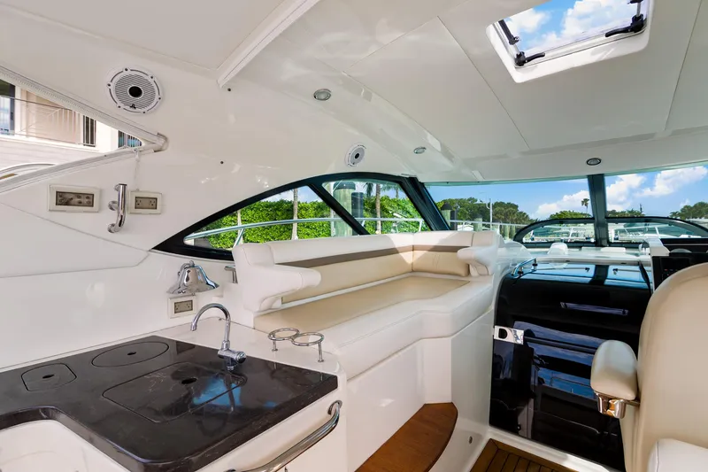 Slide: The Image of Interior of 2013 Sea Ray 410 Sundancer yacht with sleek design and modern amenities. - 15