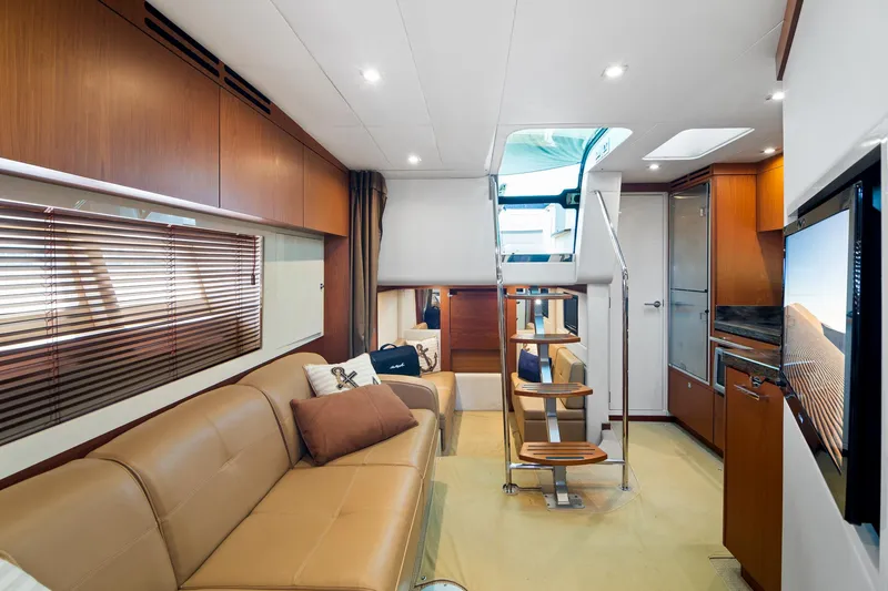 Slide: The Image of Luxurious interior of 2013 Sea Ray 410 Sundancer yacht with modern furnishings and elegant design. - 16